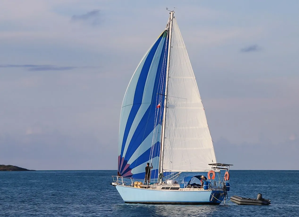 Cherie in the wild sailing by spinnaker in the Bahamas.
